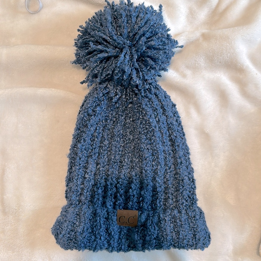 C.C. Knit Blue beanie with large Pom Pom.